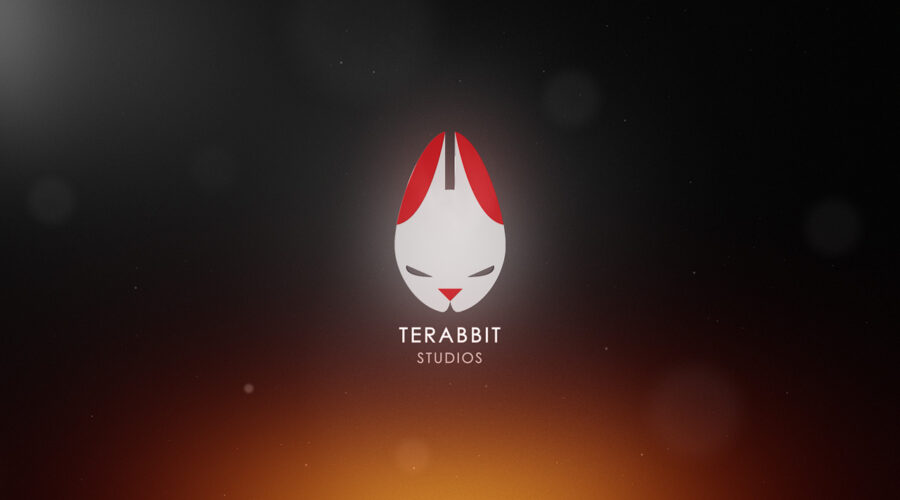 Terabbit Studios Logo is centered in the image, with the Terabbit Studios text centered blow it. The background is a smooth gradient between orange on the lower portion and dark grey on the top. There are some bokeh spekles throughout for effect.