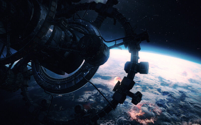 Screen capture of the orbital station from Terabbit Studios' game, the Last Ark. A massive circular orbital station is in high orbit above the Earth, high enough into space where the curvature of the planet is visible, and we can see the surface of the planet is being bombarded by nuclear warfare, and becoming isolated and cold.